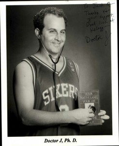 My headshot as "Dr. J" after finishing my PhD, 1997. I'm wearing the Julius Erving Sixers jersey and applying the stethscope to Rich's book. I had an alternate shot in which I wore the mortarboard.