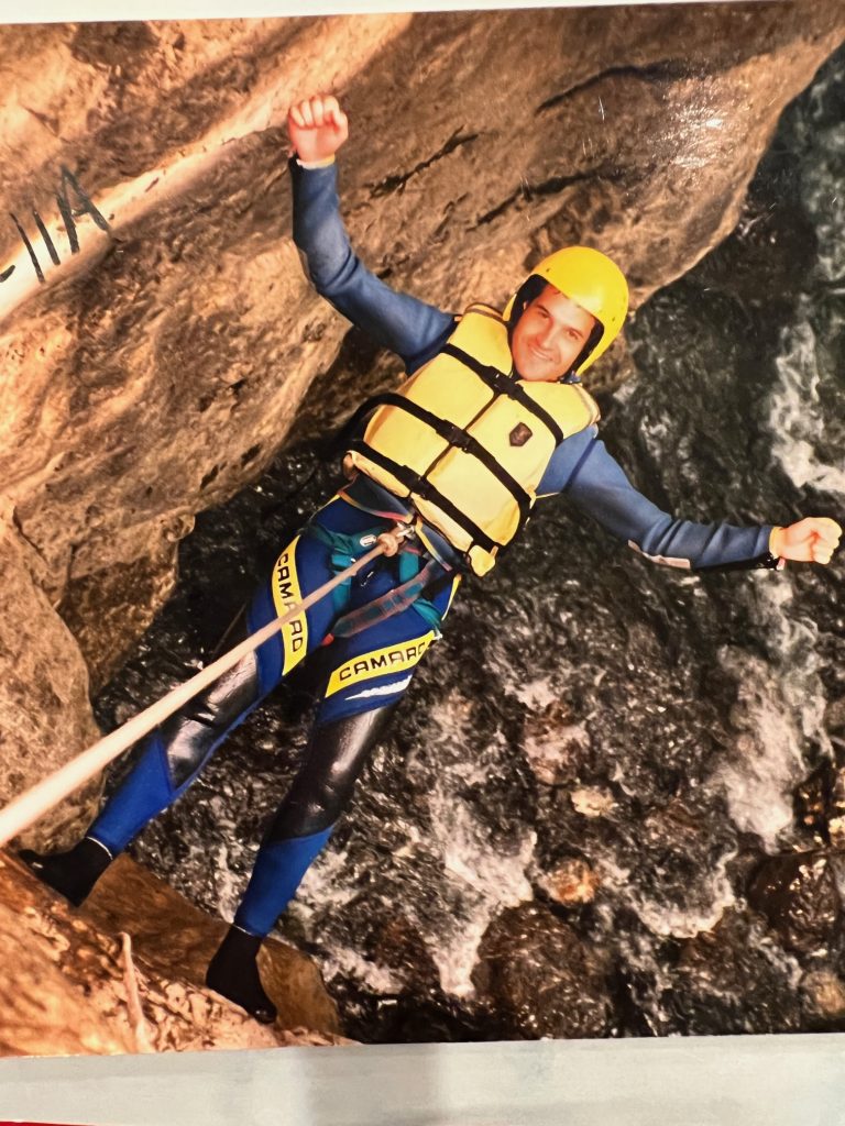 Aaron Jacobs pictured rappelling into a cave